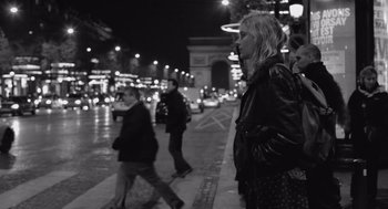Movie still from “Frances Ha” (2012), directed by Noah Baumbach – A black - and - white photo of people walking down a street; Medium shot, Over the shoulder angle