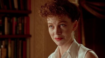 Movie still from “Naked Lunch” (1991), directed by David Cronenberg – A person wearing a white shirt; Close Up shot, Low angle