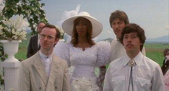 Movie still from “Napoleon Dynamite” (2004), directed by Jared Hess – A group of people standing next to each other wearing hats; Medium shot, Low angle