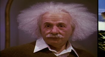 Movie still from “Naqoyqatsi” (2002), directed by Godfrey Reggio – An older man with a white wig on his head; Close Up shot, Low angle