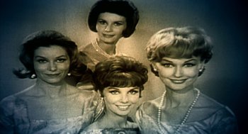 Movie still from “Naqoyqatsi” (2002), directed by Godfrey Reggio – A group of women posing for a picture; Close Up shot, Low angle