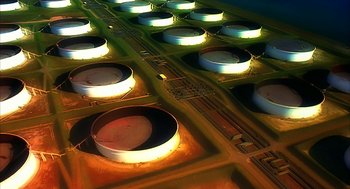 Movie still from “Naqoyqatsi” (2002), directed by Godfrey Reggio – An aerial view of a bunch of oil storage tanks; Extreme Wide shot, Overhead angle