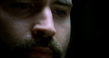 Movie still from “Narc” (2002), directed by Joe Carnahan – A man with a mustache; Extreme Close Up shot, Low angle
