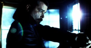 Movie still from “Narc” (2002), directed by Joe Carnahan – A person wearing a leather jacket; Close Up shot, Low angle