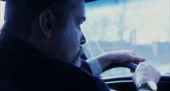 Movie still from “Narc” (2002), directed by Joe Carnahan – A person in a car; Close Up shot, Over the shoulder angle