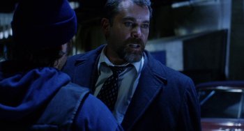 Movie still from “Narc” (2002), directed by Joe Carnahan – A man in a suit and tie talking to a woman; Close Up shot, Over the shoulder angle