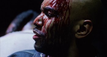 Movie still from “Narc” (2002), directed by Joe Carnahan – A person with blood on his face; Extreme Close Up shot, Overhead angle