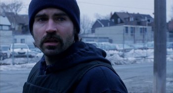 Movie still from “Narc” (2002), directed by Joe Carnahan – A person wearing a jacket and a hat; Close Up shot, Over the shoulder angle