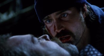 Movie still from “Narc” (2002), directed by Joe Carnahan – A person with a beard and a hat on; Close Up shot, Low angle