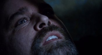 Movie still from “Narc” (2002), directed by Joe Carnahan – A man with a beard; Extreme Close Up shot, Overhead angle