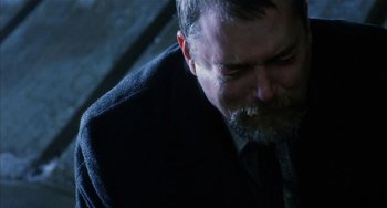 Movie still from “Narc” (2002), directed by Joe Carnahan – A person wearing a suit and tie; Close Up shot, Over the shoulder angle