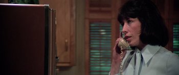Movie still from “Nashville” (1975), directed by Robert Altman – A woman talking on a phone in front of a mirror; Close Up shot, Over the shoulder angle