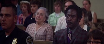 Movie still from “Nashville” (1975), directed by Robert Altman – A group of people sitting in front of each other; Close Up shot, Low angle