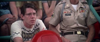 Movie still from “Nashville” (1975), directed by Robert Altman – A man sitting in front of a fire hydrant; Close Up shot, Low angle