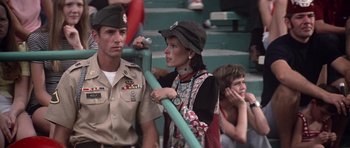 Movie still from “Nashville” (1975), directed by Robert Altman – A man and a woman standing next to each other in front of a crowd of onlookers; Medium shot, Low angle