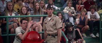 Movie still from “Nashville” (1975), directed by Robert Altman – A man in a military uniform standing in front of a group of people; Medium shot, Low angle