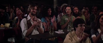 Movie still from “Nashville” (1975), directed by Robert Altman – A group of people clapping at a party; Medium shot, Over the shoulder angle