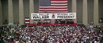 Movie still from “Nashville” (1975), directed by Robert Altman – A crowd of people gathered in front of an american flag; Extreme Wide shot, High angle