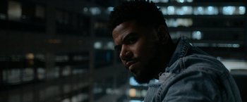 Movie still from “National Champions” (2021), directed by Ric Roman Waugh – A person with a beard; Close Up shot, Over the shoulder angle