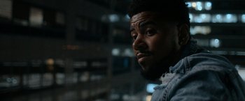 Movie still from “National Champions” (2021), directed by Ric Roman Waugh – A person with a beard; Close Up shot, Over the shoulder angle