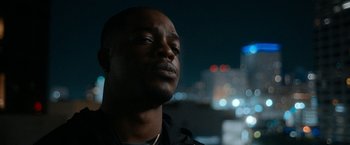 Movie still from “National Champions” (2021), directed by Ric Roman Waugh – A person with his eyes closed; Close Up shot, Low angle