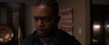 Movie still from “National Champions” (2021), directed by Ric Roman Waugh – A person wearing a black shirt; Close Up shot, Over the shoulder angle