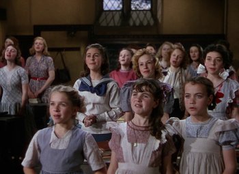 Movie still from “National Velvet” (1944), directed by Clarence Brown – A group of young girls standing next to each other; Medium shot, Low angle