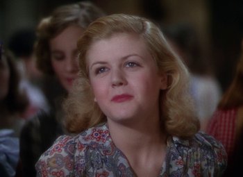 Movie still from “National Velvet” (1944), directed by Clarence Brown – A person wearing a floral shirt; Close Up shot, Over the shoulder angle