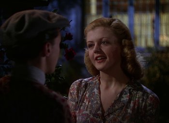 Movie still from “National Velvet” (1944), directed by Clarence Brown – A man and a woman talking to each other; Medium shot, Low angle