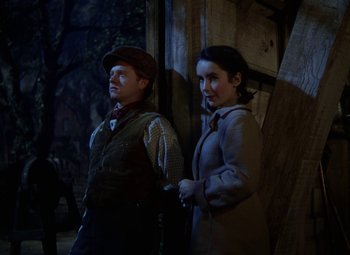 Movie still from “National Velvet” (1944), directed by Clarence Brown – A man and a woman standing next to each other; Medium shot, Over the shoulder angle