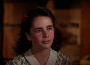 Movie still from “National Velvet” (1944), directed by Clarence Brown – A young girl is looking into the camera; Close Up shot, High angle