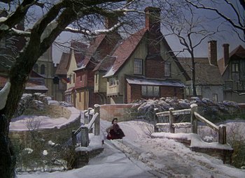 Movie still from “National Velvet” (1944), directed by Clarence Brown – A person sitting on a bench in the snow; Extreme Wide shot, High angle