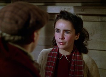 Movie still from “National Velvet” (1944), directed by Clarence Brown – A young woman wearing a red and white plaid scarf; Close Up shot, Over the shoulder angle