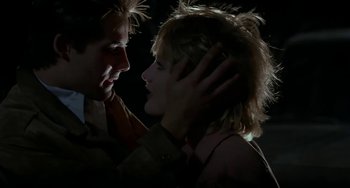 Movie still from “Near Dark” (1987), directed by Kathryn Bigelow – A man and a woman face to face in the dark; Close Up shot, Low angle