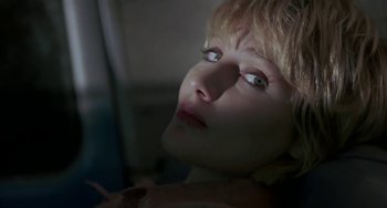 Movie still from “Near Dark” (1987), directed by Kathryn Bigelow – A woman's face in the dark; Close Up shot, Low angle