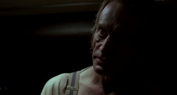 Movie still from “Near Dark” (1987), directed by Kathryn Bigelow – A person wearing a white shirt; Close Up shot, Low angle