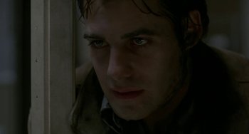 Movie still from “Near Dark” (1987), directed by Kathryn Bigelow – A man's face in the dark; Close Up shot, Low angle