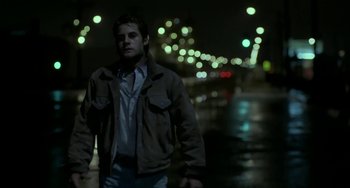Movie still from “Near Dark” (1987), directed by Kathryn Bigelow – A man standing in the street at night; Medium shot, Low angle