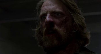 Movie still from “Near Dark” (1987), directed by Kathryn Bigelow – A person with blood on his face; Close Up shot, Low angle