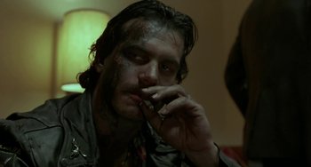 Movie still from “Near Dark” (1987), directed by Kathryn Bigelow – A person smoking a cigarette; Close Up shot, Low angle