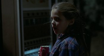 Movie still from “Near Dark” (1987), directed by Kathryn Bigelow – A young girl is holding a can of soda; Close Up shot, Over the shoulder angle