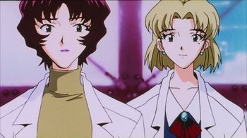 Movie still from “Neon Genesis Evangelion: Death & Rebirth” (1997), directed by Tensai Okamura – A couple of people standing next to each other; Close Up shot, Low angle
