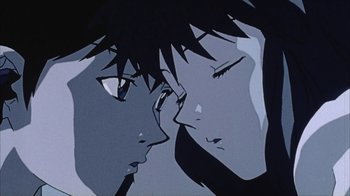 Movie still from “Neon Genesis Evangelion: Death & Rebirth” (1997), directed by Tensai Okamura – A couple of people that are looking at each other; Extreme Close Up shot, Low angle