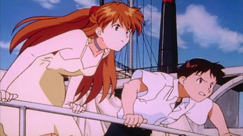 Movie still from “Neon Genesis Evangelion: Death & Rebirth” (1997), directed by Tensai Okamura – A woman standing next to a man on top of a boat; Medium shot, Low angle