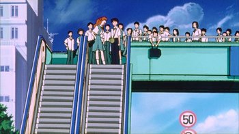 Movie still from “Neon Genesis Evangelion: Death & Rebirth” (1997), directed by Tensai Okamura – A group of people standing on top of a set of stairs; Extreme Wide shot, Low angle