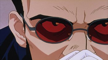 Movie still from “Neon Genesis Evangelion: Death & Rebirth” (1997), directed by Tensai Okamura – A person's eye wearing a pair of sunglasses; Extreme Close Up shot, Low angle