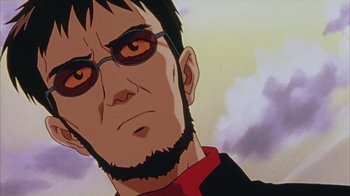 Movie still from “Neon Genesis Evangelion: Death & Rebirth” (1997), directed by Tensai Okamura – A man's face in a cartoon; Close Up shot, Low angle