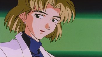 Movie still from “Neon Genesis Evangelion: Death & Rebirth” (1997), directed by Tensai Okamura – A person with long blonde hair; Close Up shot, Low angle