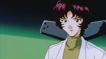 Movie still from “Neon Genesis Evangelion: Death & Rebirth” (1997), directed by Tensai Okamura – A woman holding a cell phone up to her face; Close Up shot, Low angle