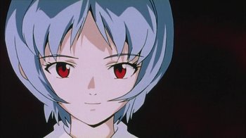 Movie still from “Neon Genesis Evangelion: Death & Rebirth” (1997), directed by Tensai Okamura – A person's face with red eyes; Extreme Close Up shot, Low angle